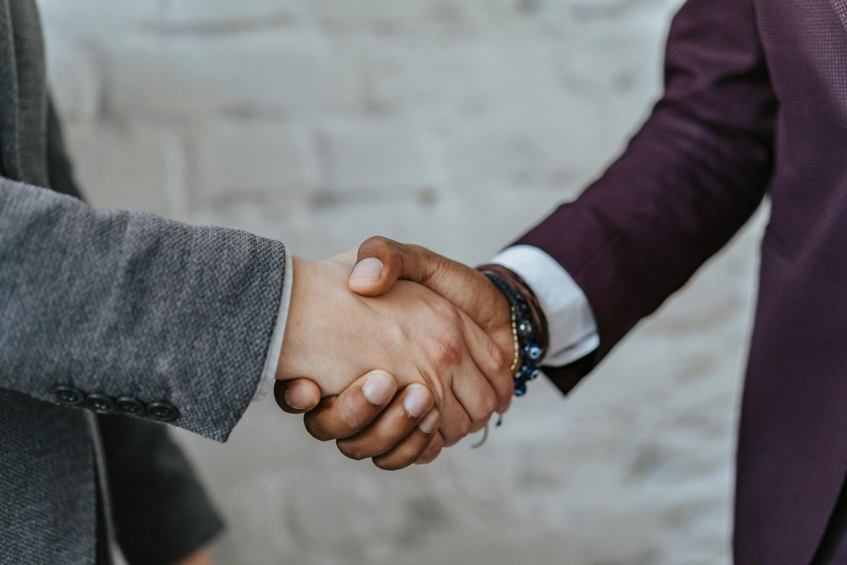 two people doing hand shake